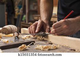 carpenter taking measuremt carpenter taking measuremt