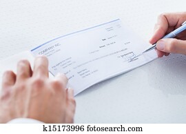 Close-up Of Hand Filling Cheque