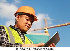  construction worker using digital tablet