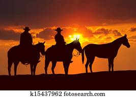 cowboys and horses under sunset cowboys and horses under sunset