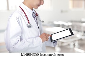 Doctor showing tablet pc in hospital