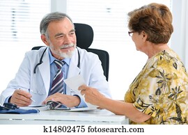 Doctor talking to his female patient