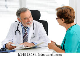 Doctor talking to his female patient