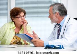Doctor talking to his female patient