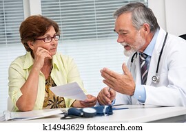 Doctor talking to his female patient