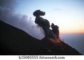 Erupting volcano at dawn