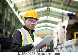 Factory worker with clipboard on the hand Factory worker with clipboard on the hand