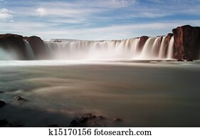 Godafoss waterfalls with mountain in Iceland Godafoss waterfalls with mountain in Iceland