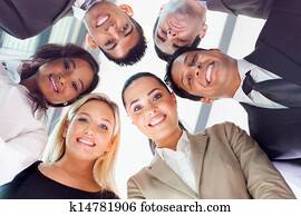 group of business people looking down