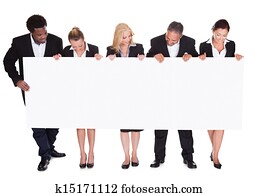 Group Of Businesspeople Holding Placard