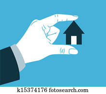 Hand holding small house