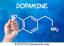 hand with pen drawing the chemical formula of Dopamine hand with pen drawing the chemical formula of Dopamine