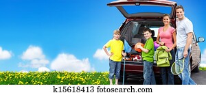 Happy family near new car.