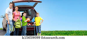 Happy family near new car.
