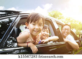 happy little girl with family sitting in the car happy little girl with family sitting in the car
