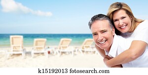 Happy senior couple on a tropical beach.
