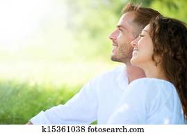 Happy Smiling Couple Relaxing in a Park. Picnic