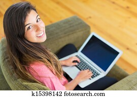 happy young woman using a laptop computer
