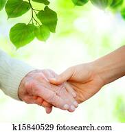 Holding hands with senior Holding hands with senior