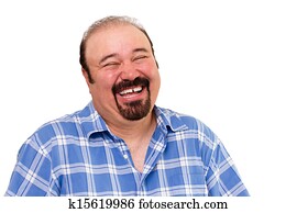 Joyful bearded Caucasian man laughing loud