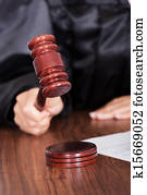 Judge Striking The Gavel In A Courtroom Judge Striking The Gavel In A Courtroom