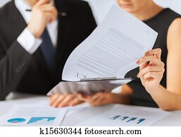 man and woman signing contract paper man and woman signing contract paper