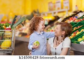 Mother and daughter in the food department Mother and daughter in the food department