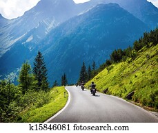 Moto racers on mountainous road