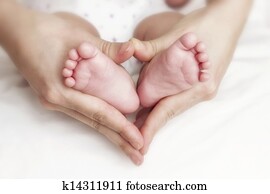 Newborn baby feet in the mother hands Newborn baby feet in the mother hands