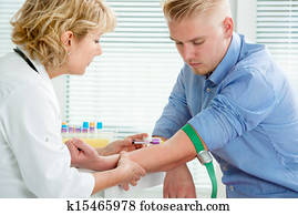 Nurse taking blood sample