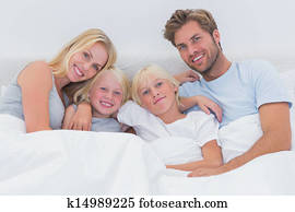 Portrait of a family in bed Portrait of a family in bed