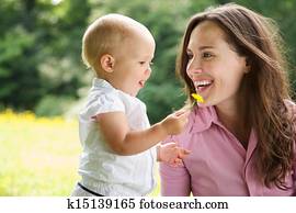 Portrait of a mother and child smiling outdoors Portrait of a mother and child smiling outdoors