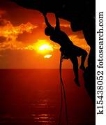 rock climbing during sunset