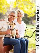 senior couple and pet dog