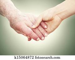 Senior Lady Holding Hands with Young Woman