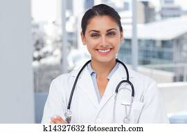 Smiling doctor standing