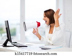 Strict businesswoman shouting in megaphone