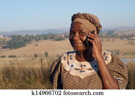 Traditional African Zulu woman speaking on mobile phone Traditional African Zulu woman speaking on mobile phone