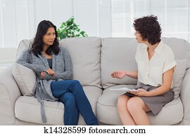 Woman listening to her therapist Woman listening to her therapist
