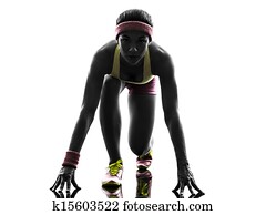 woman runner running on starting blocks silhouette