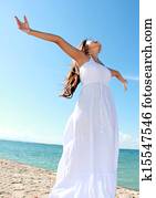 Woman with arms open enjoying her freedom