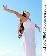 Woman with arms open enjoying her freedom