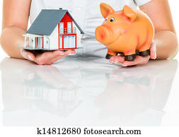 woman with house and piggy bank