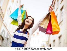 woman with shopping bags in city woman with shopping bags in city