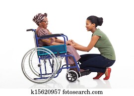 african daughter talking to disabled senior mother