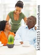 african girl talking to senior parents