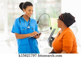 african medical nurse and senior patient