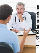 Attentive doctor listening to his patient