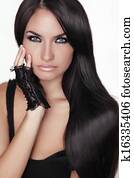 Beautiful Brunette Girl. Healthy Long Hair. Beauty Model Woman. Hairstyle. Girl Portrait isolated on a white background. 