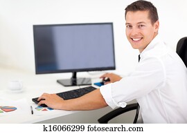 businessman working on a computer in office businessman working on a computer in office